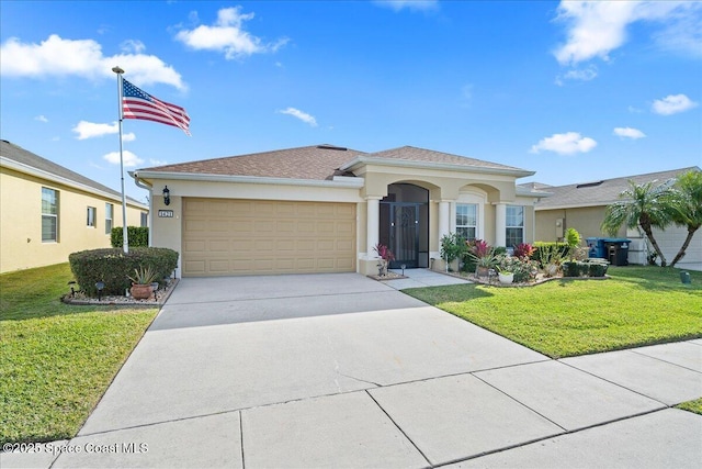 view of front of property with a garage and a front yard