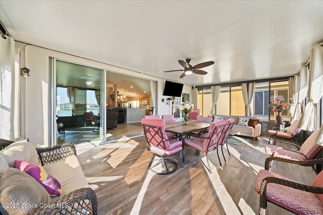 sunroom / solarium with ceiling fan