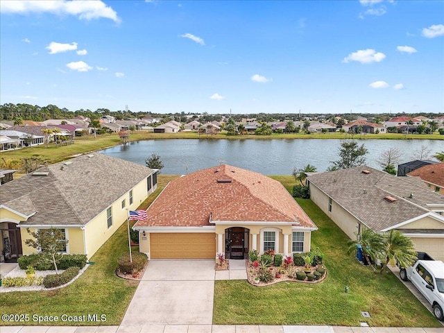 birds eye view of property featuring a water view