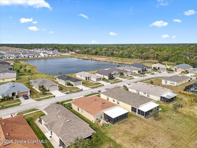 drone / aerial view with a water view