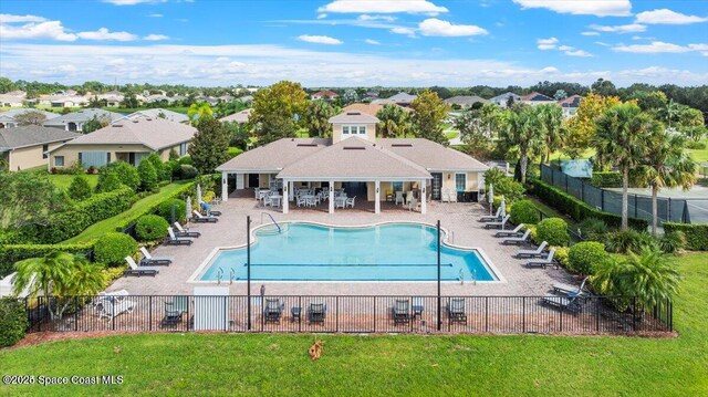 view of swimming pool with a patio area and a lawn