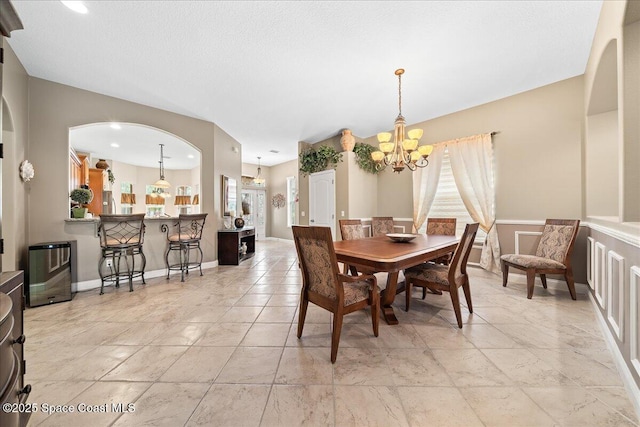 dining room featuring a notable chandelier