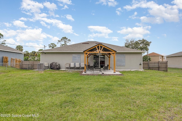 back of house with a patio area, central AC unit, and a lawn