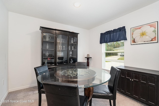 view of carpeted dining area