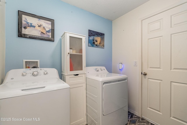 laundry area with washing machine and clothes dryer