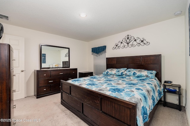 bedroom featuring light colored carpet