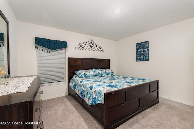 bedroom with light colored carpet