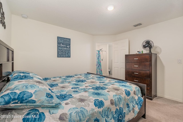 carpeted bedroom with a textured ceiling