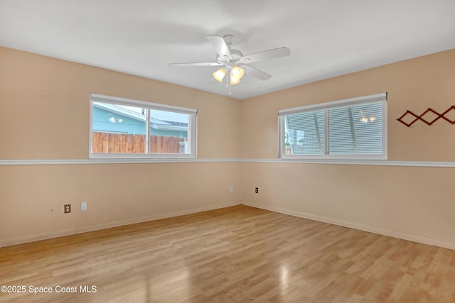 spare room with ceiling fan and light hardwood / wood-style floors