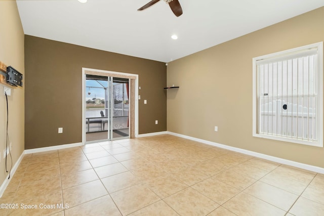 unfurnished room featuring ceiling fan and light tile patterned floors