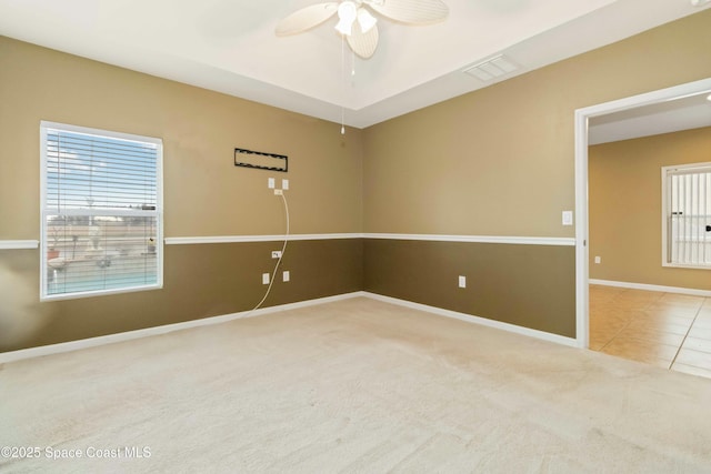 tiled empty room with ceiling fan