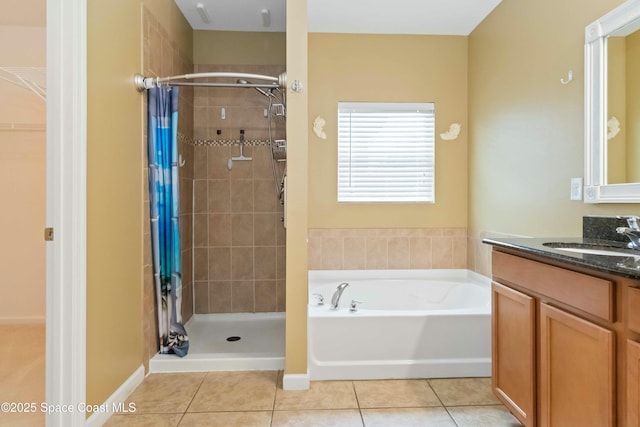 bathroom featuring vanity, independent shower and bath, and tile patterned flooring