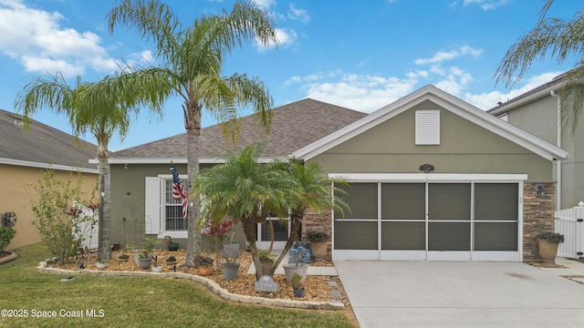 view of front of house featuring a garage and a front yard