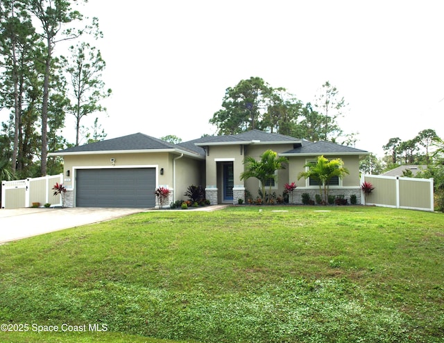 view of front facade featuring a garage and a front lawn