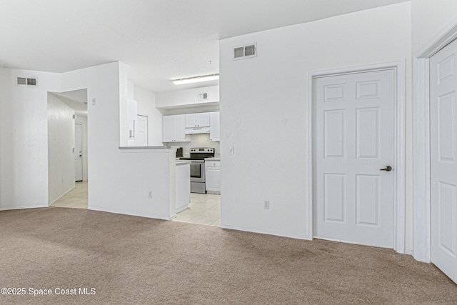 unfurnished room with light colored carpet