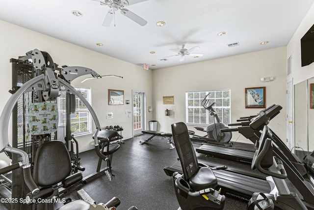 workout area with ceiling fan and a healthy amount of sunlight