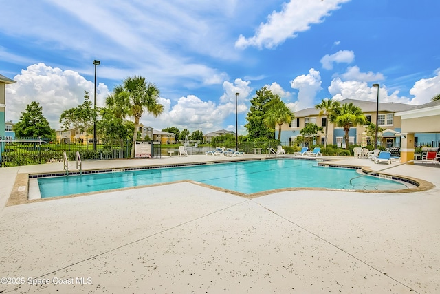 view of swimming pool with a patio