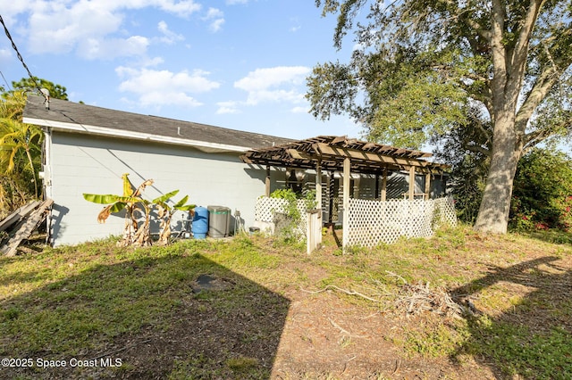 back of house with a pergola