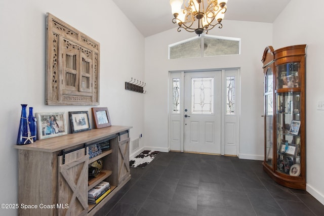 foyer featuring an inviting chandelier and lofted ceiling