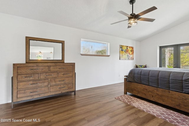 bedroom with dark hardwood / wood-style flooring, lofted ceiling, and ceiling fan