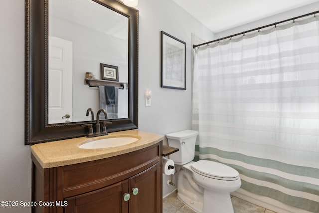 bathroom with vanity, tile patterned flooring, toilet, and walk in shower