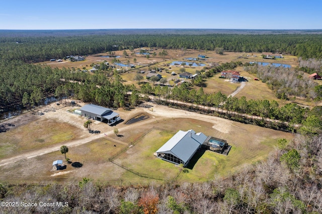 birds eye view of property featuring a rural view