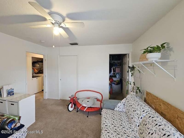 interior space with light colored carpet and ceiling fan