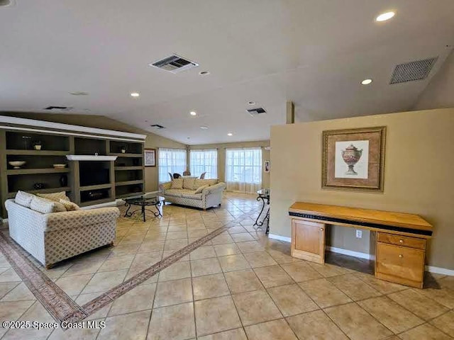 tiled living room with vaulted ceiling and built in features