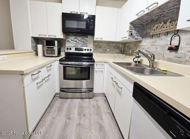 kitchen with white cabinetry, sink, stainless steel range with electric stovetop, light hardwood / wood-style floors, and white dishwasher