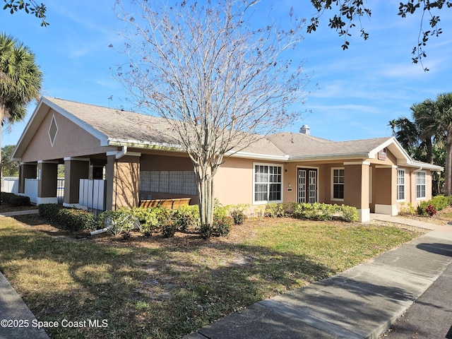 ranch-style house featuring a front yard