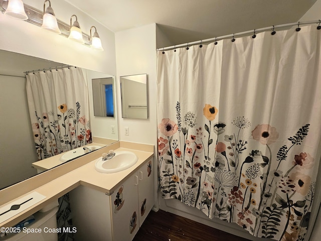 bathroom featuring hardwood / wood-style flooring and vanity