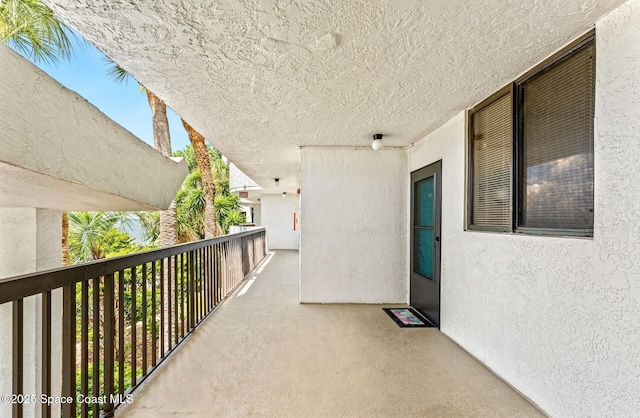 view of patio featuring a balcony