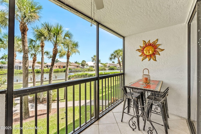 balcony featuring a water view