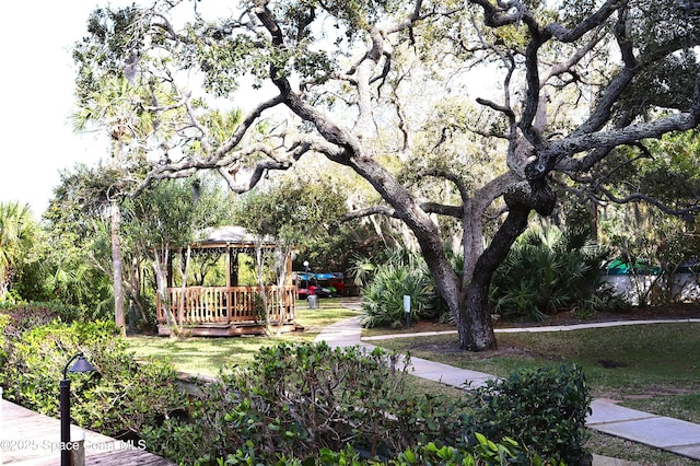 view of property's community featuring a yard and a gazebo