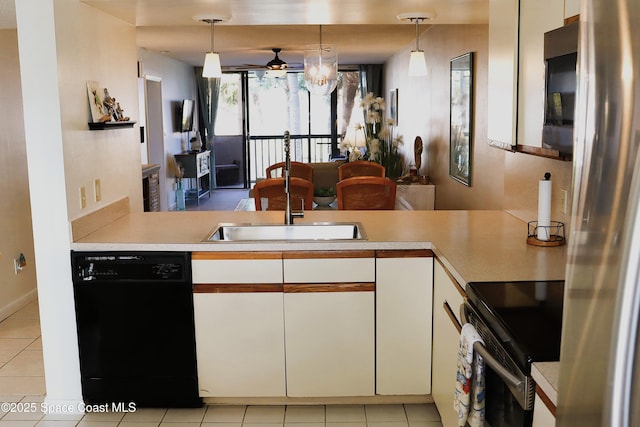 kitchen with pendant lighting, white cabinetry, appliances with stainless steel finishes, and light tile patterned flooring