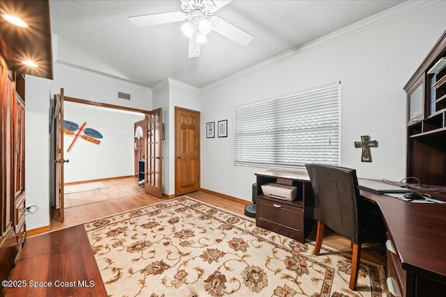 office area with ceiling fan, ornamental molding, a textured ceiling, and hardwood / wood-style flooring