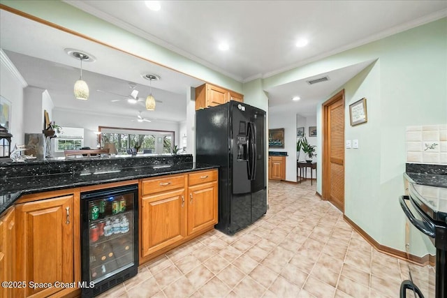 kitchen featuring beverage cooler, black appliances, decorative light fixtures, dark stone countertops, and ceiling fan