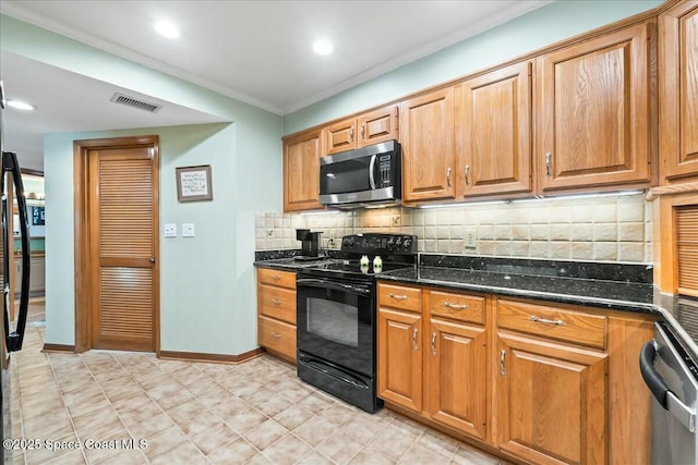 kitchen featuring tasteful backsplash, dark stone countertops, stainless steel appliances, and ornamental molding