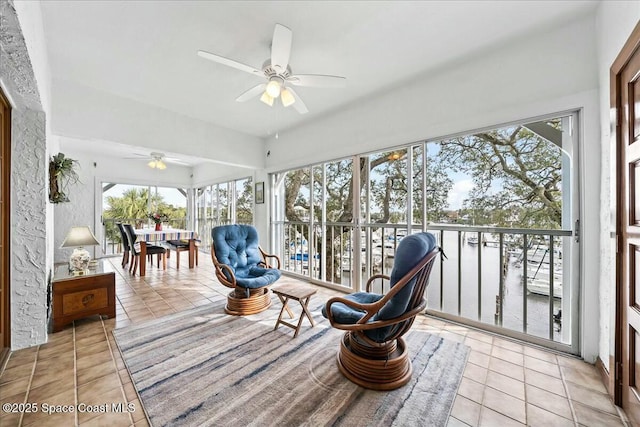 sunroom with ceiling fan and a wealth of natural light