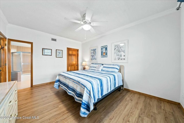 bedroom with ceiling fan, light hardwood / wood-style floors, ensuite bath, and ornamental molding