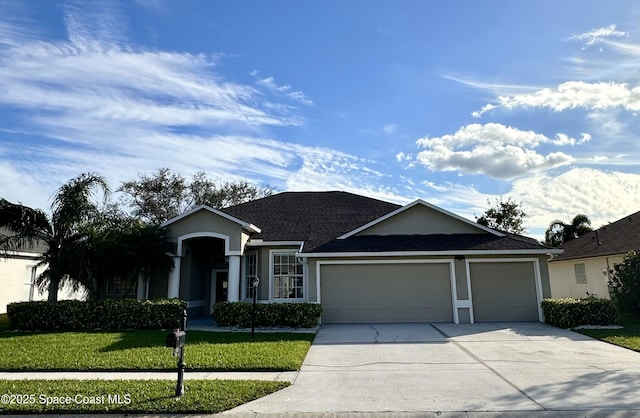 ranch-style house featuring a garage and a front lawn