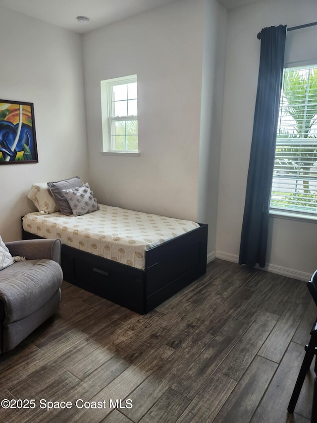 bedroom featuring dark hardwood / wood-style flooring