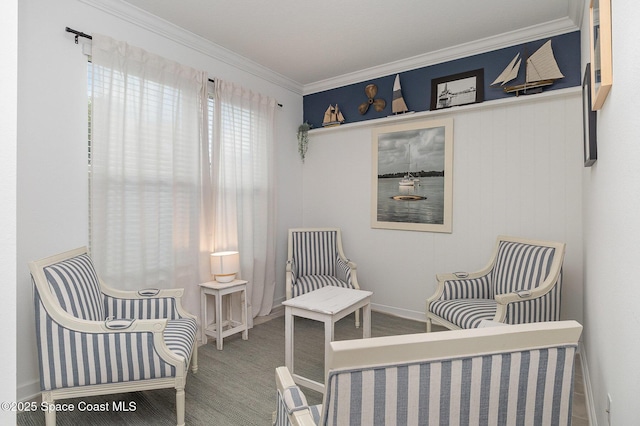 living area with crown molding