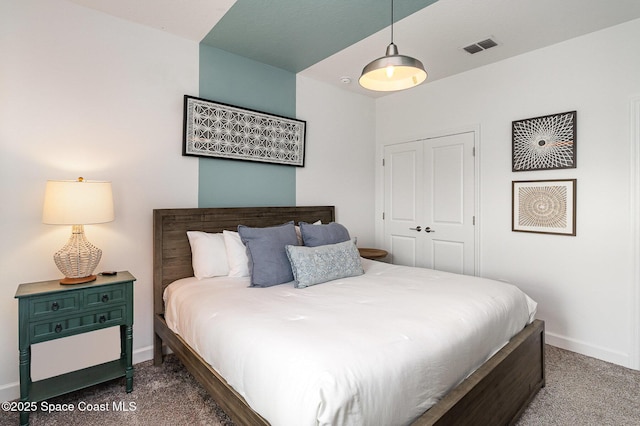 carpeted bedroom with a closet