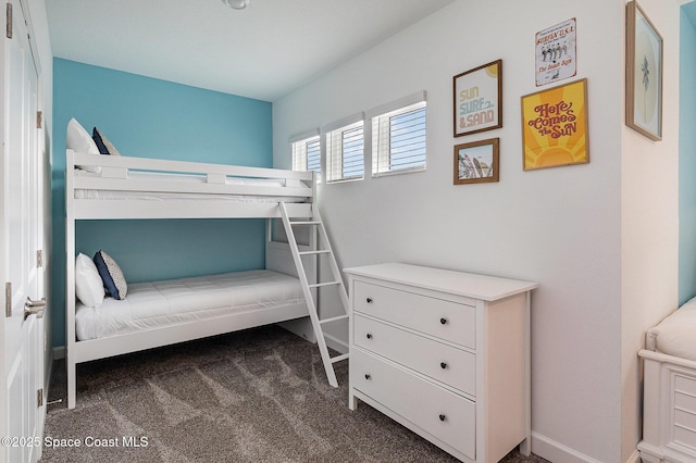 bedroom with dark carpet