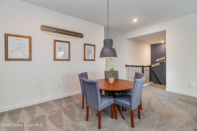 view of carpeted dining area