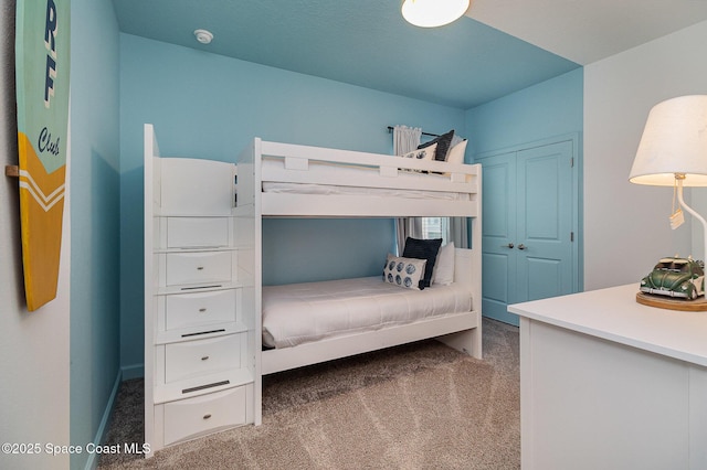 bedroom featuring dark carpet