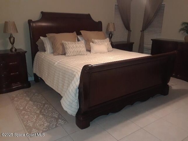 bedroom with light tile patterned flooring