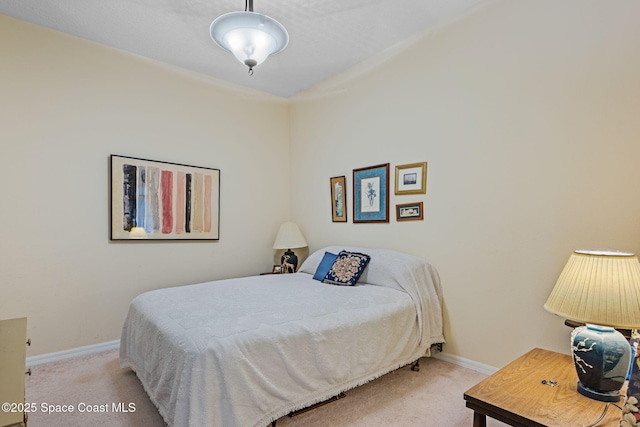 bedroom featuring light carpet