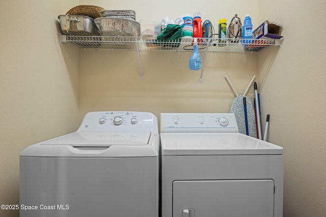 laundry room with washer and clothes dryer